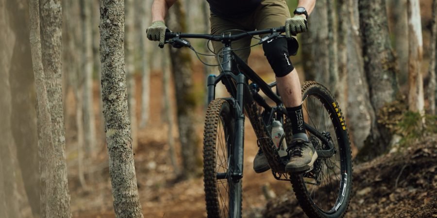 a man riding on the back of a bicycle